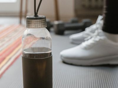 Detailed view of a yoga mat and water bottle